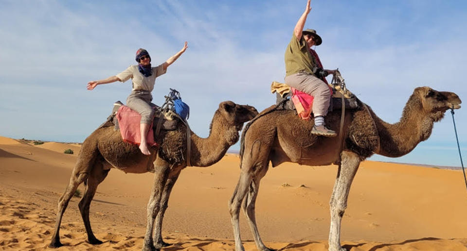 Olivia (left) and Carol (right) enjoying the camel ride moments before it all went wrong. Source: Supplied 