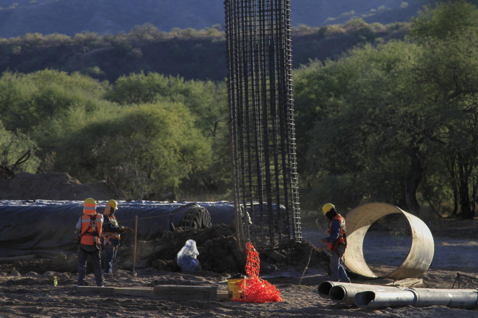 Construction continues for a new train line in northern Mexico, in San Lorenzo, Sonora state, Mexico, Monday, Nov. 13, 2023. Residents in the northern state of Sonora are battling the new train line which they say threatens to displace their homes and cut up the local ecosystem. (AP Photo/Luis Castillo)