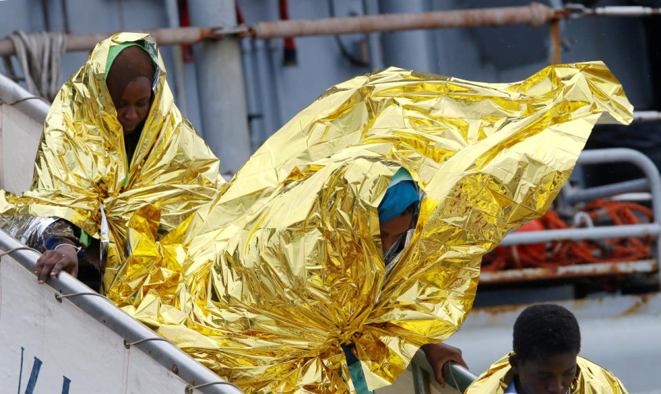 Migrants disembark from the Italian Navy vessel Aviere in the Sicilian harbour of Augusta, Italy, June 10, 2016. (REUTERS/Antonio Parrinello)