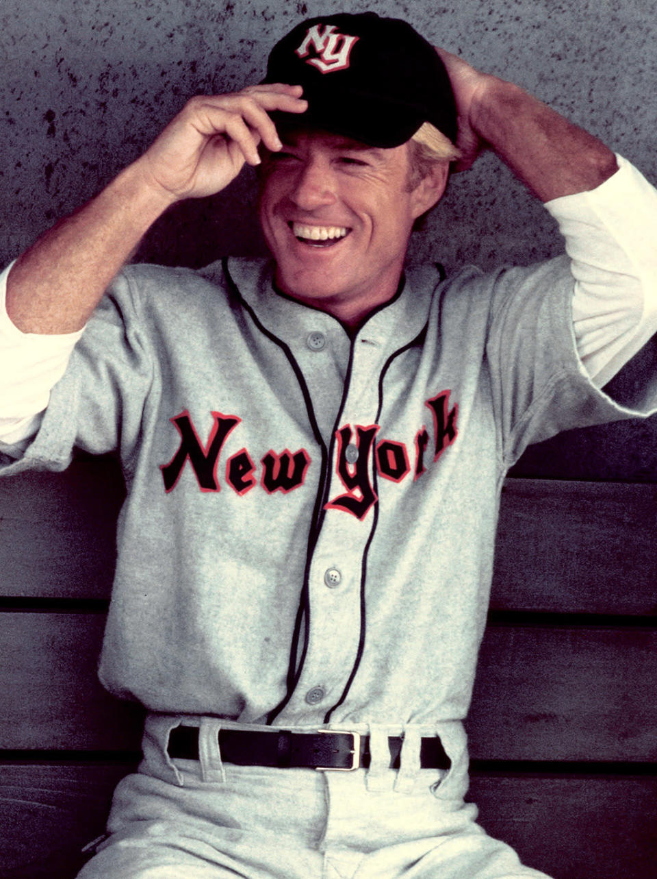 <p>A suit and tie, western duds, a baseball uniform — Redford was dashing in all of them! In 1984, he was already beginning to produce and direct successful movies, but Redford stuck to showing off his onscreen talents in <i>The Natural</i>. (Photo: Juergen Vollmer/Redferns/Getty Images)</p>