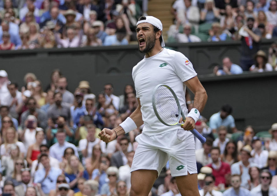 Italy's Matteo Berrettini celebrates after defeating Poland's Hubert Hurkacz during the men's singles semifinals match on day eleven of the Wimbledon Tennis Championships in London, Friday, July 9, 2021. (AP Photo/Alberto Pezzali)