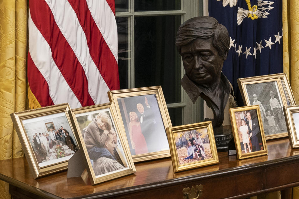 FILE - This Wednesday, Jan. 20, 2021, file photo shows the newly redecorated Oval Office of the White House in Washington. Paul Chavez had no idea where a sculpture of his father, Latino American civil rights and labor leader Cesar Chavez, would end up in the White House. He agreed just this week to lend the bronze bust to President Joe Biden and hustled to get it wrapped up and shipped across the country from California. It was an utter surprise Wednesday when he saw Biden at his desk in the Oval Office, with the bust of the late Cesar Chavez right behind the president. (AP Photo/Alex Brandon, File)