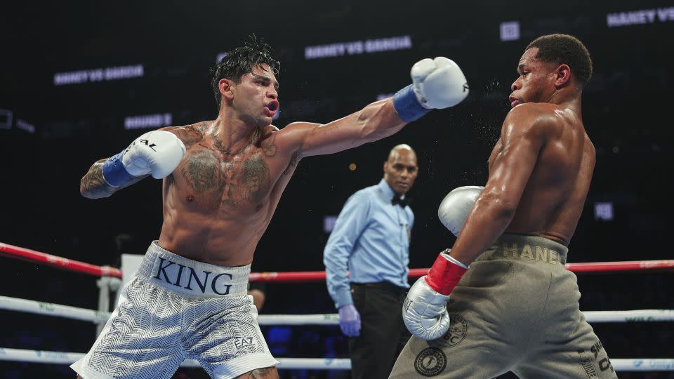 Garcia throws a punch at Haney. - Cris Esqueda/Golden Boy/Getty Images