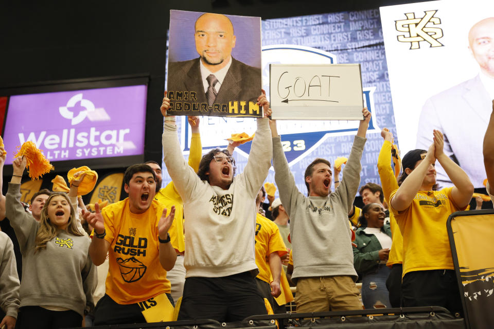 Kennesaw State fans cheer as head coach Amir Abdur-Rahim is introduced at the beginning of the ASUN Conference championship basketball game against Liberty, Sunday, March 5, 2023, in Kennesaw, Ga. (Miguel Martinez/Atlanta Journal-Constitution via AP)