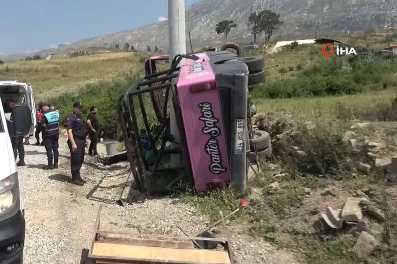 The overturned bus after the smash