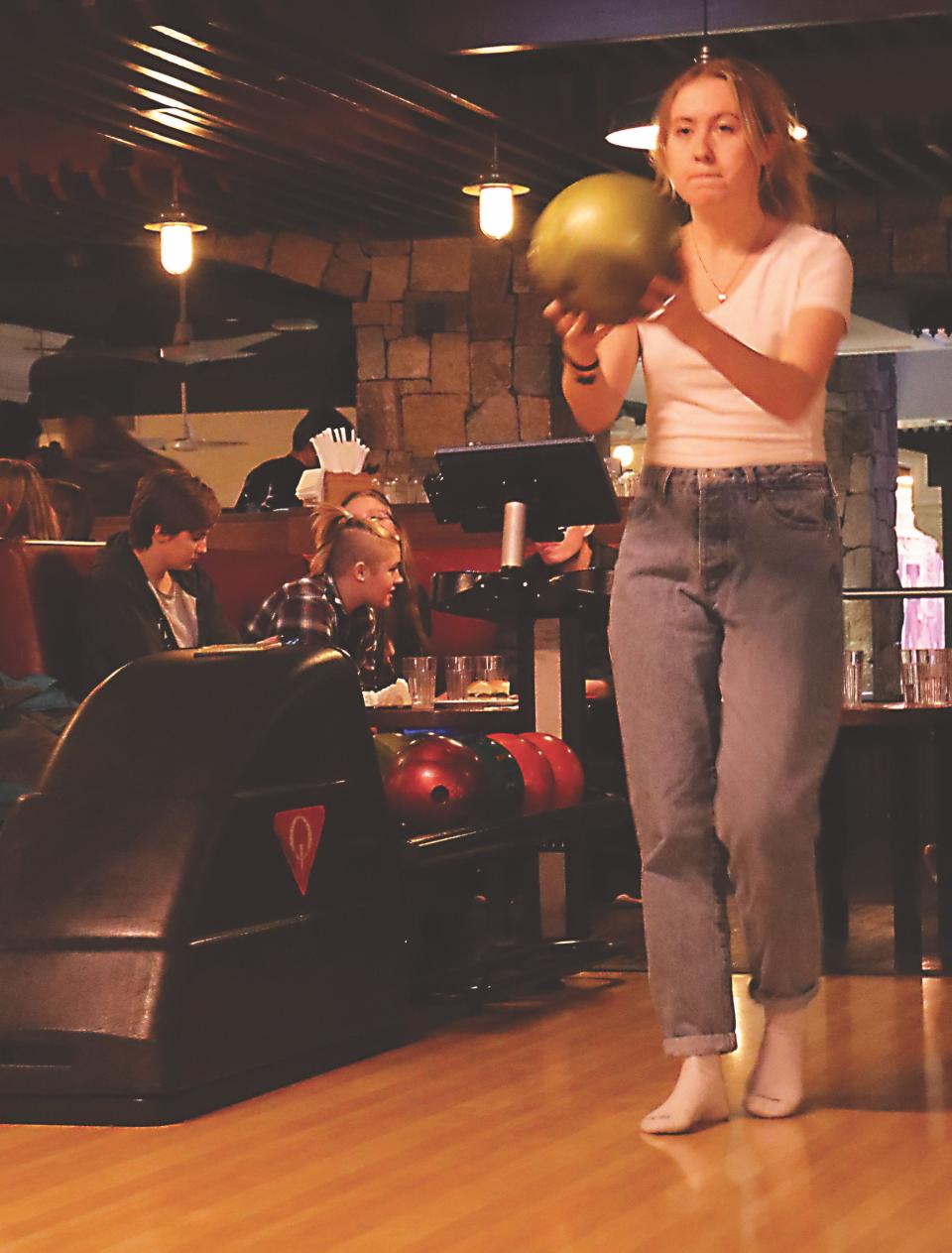 Katelyn Winberg, junior trumpet player, concentrates on knocking down the pins with her ball.