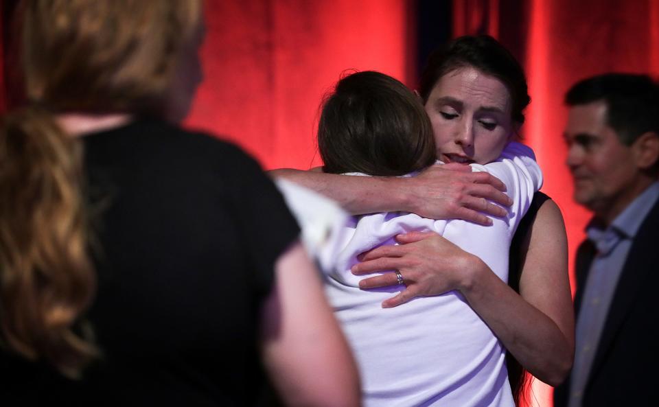 Rachael Denhollander hugs Madeline, a sexual abuse survivor, after a panel discussion on abuse in the church the night before the Southern Baptist Convention opened in Birmingham, Alabama.