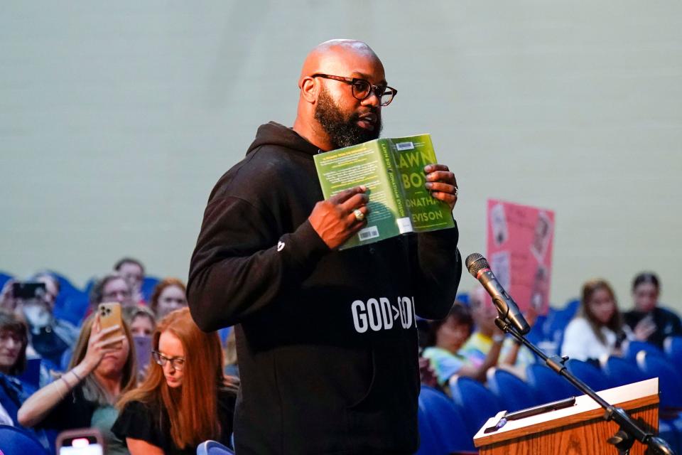 Pastor John Amanchukwu reads a sexually explicit excerpt from the book "Lawn Boy," in support of banning certain books during the public comment portion of the Roxbury board of education meeting on June 12, 2023.