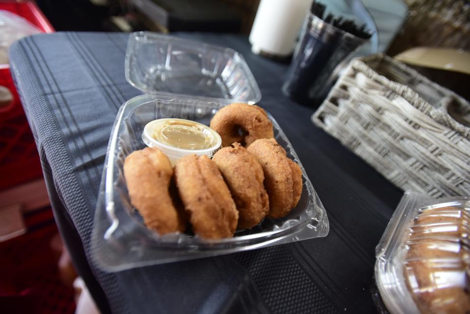 McCallum’s Orchard and Cider Mill offers a variety of donuts with dipping sauce at the pod at the Lot venue at Fourth and Water streets in downtown Port Huron on Friday, July 8, 2022.