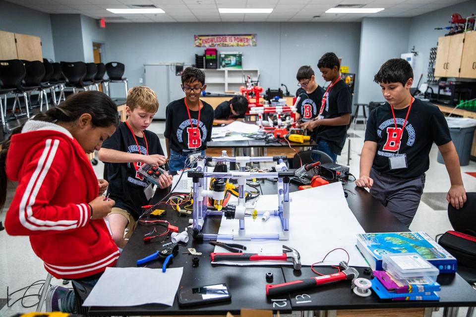 The Baker Middle School robotics team works on projects at the school on Friday, June 24, 2022. The team's robots will face off against others at a competition later in the year.