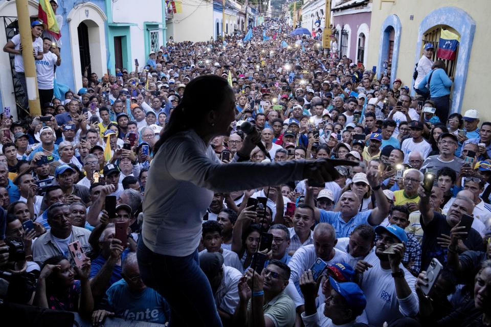 FILE - Opposition presidential hopeful Maria Corina Machado speaks to supporters during a rally in Valencia, Carabobo State, Venezuela, Oct. 5, 2023. Machado rose from a hiatus to the top of the opposition leadership. (AP Photo/Ariana Cubillos, File)