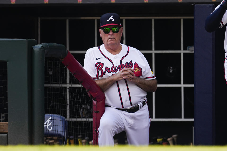 Atlanta Braves manager Brian Snitker watches from the ddugout during a baseball game against the Washington Nationals, Sunday, Oct. 1, 2023, in Atlanta. (AP Photo/John Bazemore)