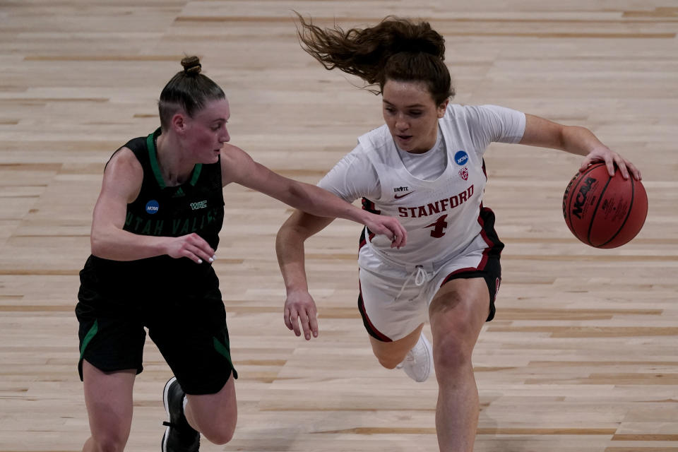 Stanford guard Jana Van Gytenbeek (4) drives under pressure from Utah Valley guard Maria Carvalho (3) during the first half of a college basketball game in the first round of the women's NCAA tournament at the Alamodome in San Antonio, Sunday, March 21, 2021. (AP Photo/Charlie Riedel)