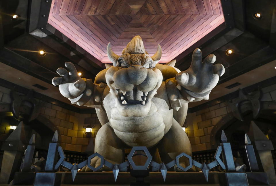 A statue of Bowser or King Koopa is displayed inside Bowser's Catsle at Super Nintendo World, a new attraction area featuring the popular video game character Mario where set to open in the spring of 2021, at the Universal Studios Japan theme park in Osaka, western Japan, November 30, 2020, in this photo taken by Kyodo.  Mandatory credit Kyodo/via REUTERS ATTENTION EDITORS - THIS IMAGE WAS PROVIDED BY A THIRD PARTY. MANDATORY CREDIT. JAPAN OUT. - RC2JDK9PB8UI