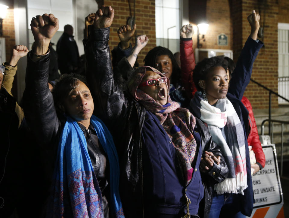 Local activists raise their fists outside Charlottesville General District Court after a guilty verdict was reached in the trial of James Alex Fields Jr., in Charlottesville, Va., Friday, Dec. 7, 2018. Fields was convicted of first degree murder in the death of Heather Heyer as well as nine other counts during a "Unite the Right" rally in Charlottesville . (AP Photo/Steve Helber)