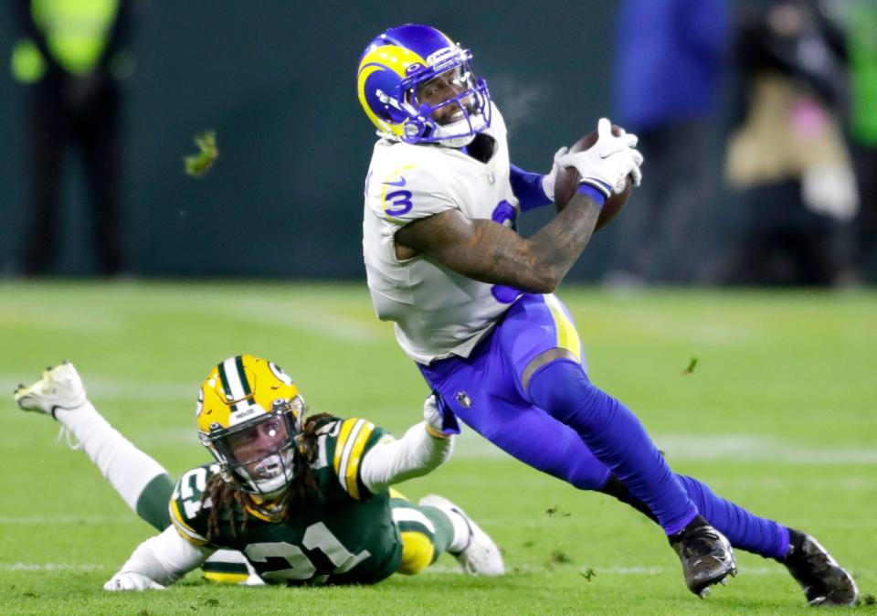 Los Angeles Rams wide receiver Odell Beckham Jr. is brought down by Green Bay Packers cornerback Eric Stokes (21) during their football game on Sunday November 28, 2021, at Lambeau Field in Green Bay, Wis.