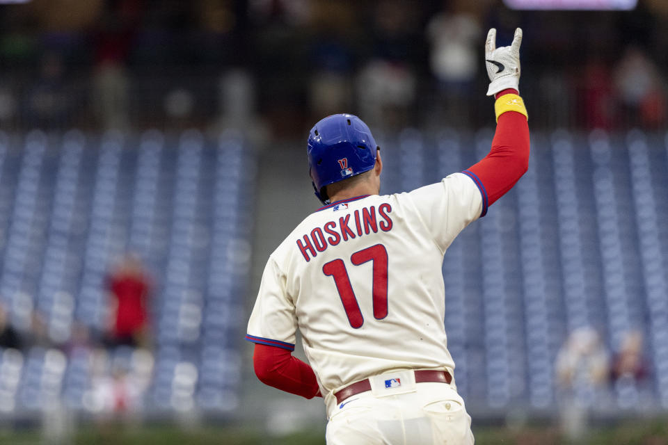 Philadelphia Phillies' Rhys Hoskins gestures after hitting a three-run home run during the fifth inning of a baseball game against the Washington Nationals, Sunday, Sept. 11, 2022, in Philadelphia. (AP Photo/Laurence Kesterson)