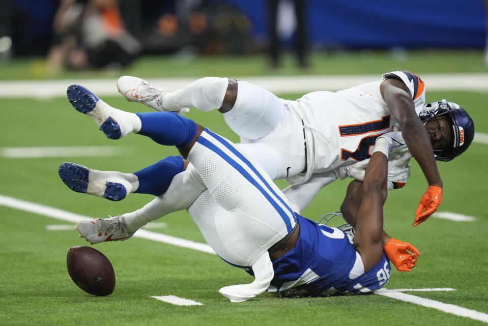 Indianapolis Colts safety Kendell Brooks (36) breaks up a pass intended for Denver Broncos wide receiver Marvin Mims Jr. (19) during the third quarter of a preseason NFL football game, Sunday, Aug. 11, 2024, in Westfield, Ind. (AP Photo/AJ Mast)