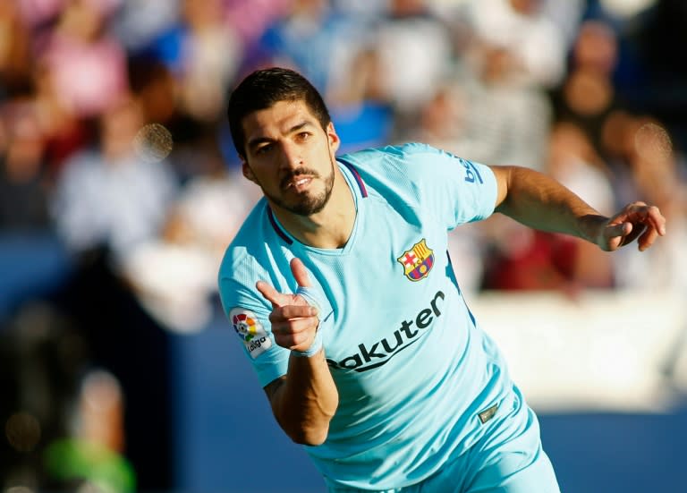 Barcelona's Luis Suarez celebrates after scoring a goal during their match against at the Butarque stadium in Leganes on November 18, 2017