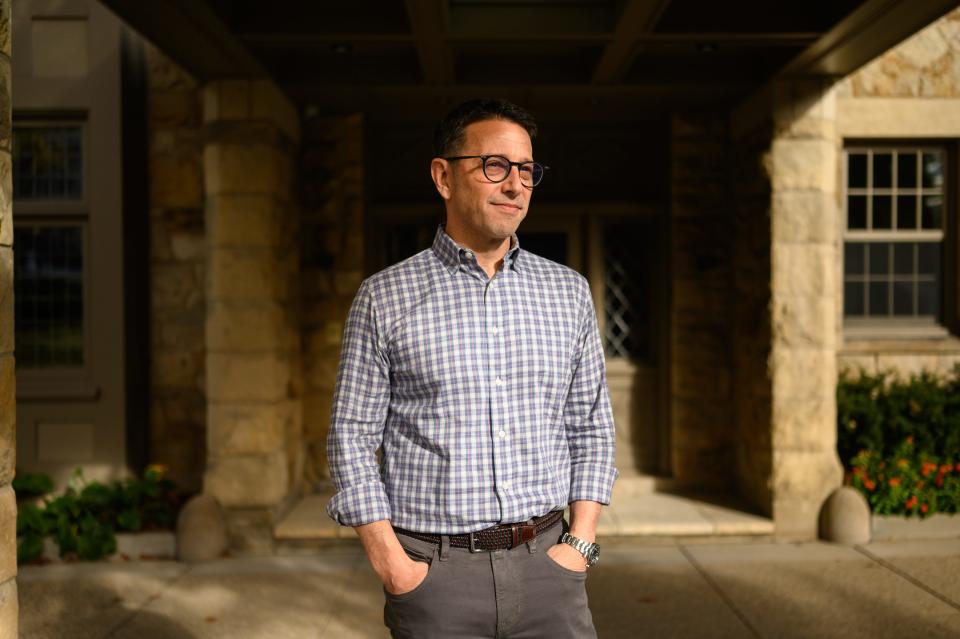 Michael Bernstein, director of the organization transforming Tree of Life into an international institution dedicated to combatting antisemitism, stands in front of his home on Wednesday, Oct. 25, 2023, in Pittsburgh's Squirrel Hill neighborhood.