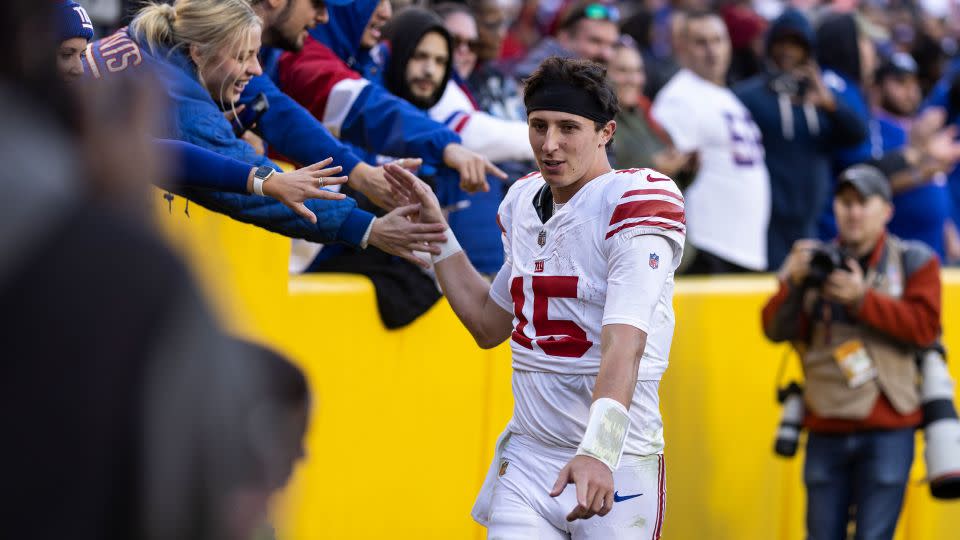 DeVito high fives fans following an NFL game between the Washington Commanders and the New York Giants at FedExField on November 19 in Landover, Maryland. - Michael Owens/Getty Images