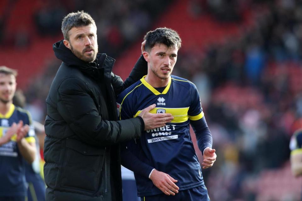 Michael Carrick congratulates Alex Gilbert <i>(Image: Tom Banks)</i>