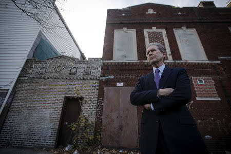 Alexander Sanger, Chair of the International Planned Parenthood Council poses for a photo outside of where his Grandmother Margaret Sanger opened the first birth control clinic 100 years ago, in the Brooklyn borough of New York, December 12, 2015. REUTERS/Carlo Allegri