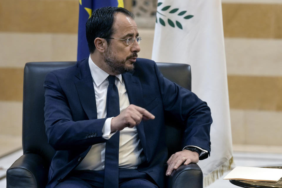 Cyprus' President Nikos Christodoulides, left, speaks during his meeting with Lebanese caretaker Prime Minister Najib Mikati, at the government headquarters in Beirut, Lebanon, Monday, April 8, 2024. Christodoulides' visit to Beirut comes after he asked the European Union last week to intervene with Lebanese authorities to stop boatloads of Syrian refugees from heading to the east Mediterranean island nation. Lebanon's caretaker prime minister asked Southern European countries along the Mediterranean Sea to pressure the European Union to help Lebanon deport undocumented migrants. (AP Photo/Bilal Hussein)