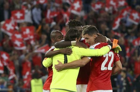 Football Soccer - Switzerland v Portugal - 2018 World Cup Qualifier - St. Jakob-Park, Basel, Switzerland - 6/9/16. Switzerland's goalkeeper Yann Sommer, Gelson Fernandes, Johan Djourou and Fabian Schaer celebrate after defeating Portugal. REUTERS/Ruben Sprich