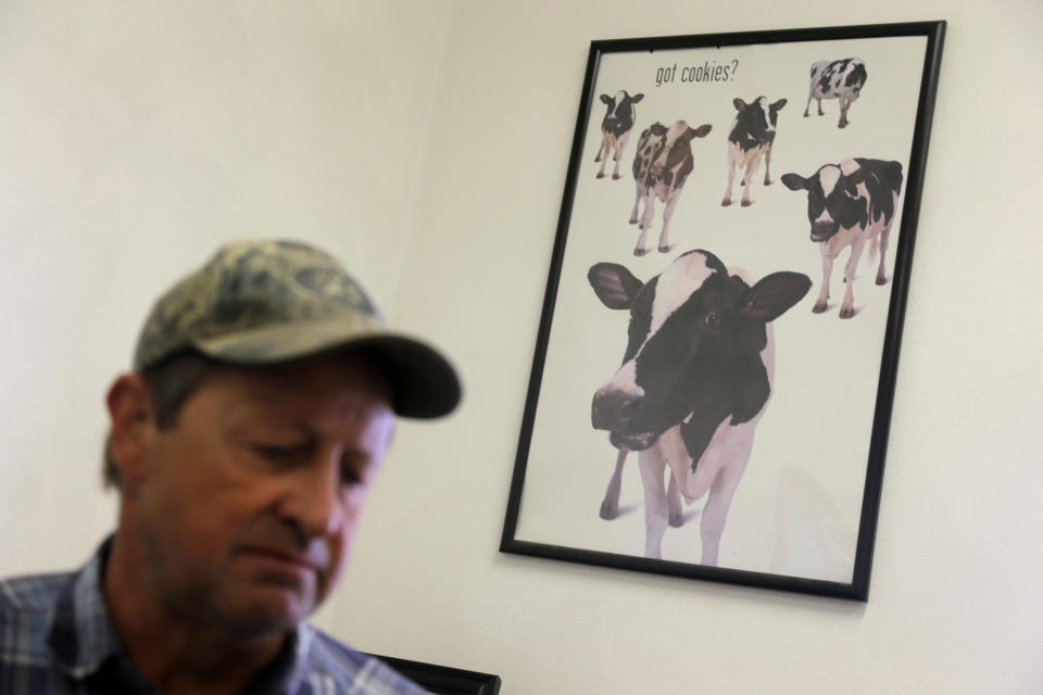 This photo taken Oct. 16, 2013 shows Larry Hasheider standing in an office on his farm in Okawville, Ill. Hasheider grows soybeans, wheat and alfalfa on the farm, nestled in the heart of Illinois corn country where he also has 130 dairy cows, 500 beef cattle and 30,000 hogs and even gives tours, something he says he never would have done 20 years ago. Add one more item to the list of chores that Larry Hasheider has to do on his 1,700-acre farm: defending his business to the American public. There's a lot of conversation about traditional agriculture recently, and much of it is critical. Among the issues people are concerned about: genetically modified crops, overuse of hormones and antibiotics, inhumane treatment of animals and whether the government subsidizes unhealthy foods. (AP Photo/Jeff Roberson)