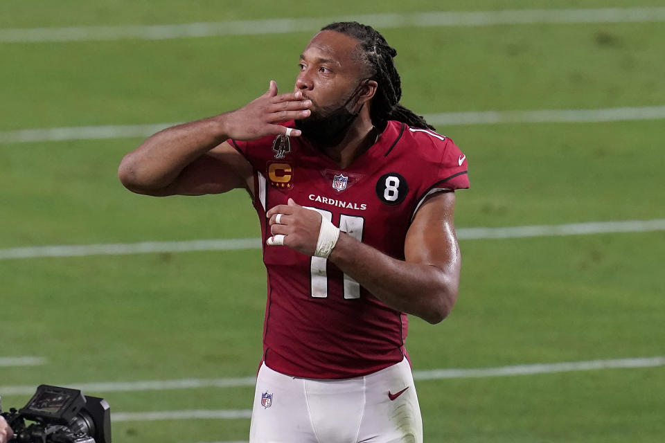 Arizona Cardinals wide receiver Larry Fitzgerald (11) blows a kiss as he leaves the field after an NFL football game against the San Francisco 49ers, Saturday, Dec. 26, 2020, in Glendale, Ariz. The 49ers won 20-12. (AP Photo/Ross D. Franklin)