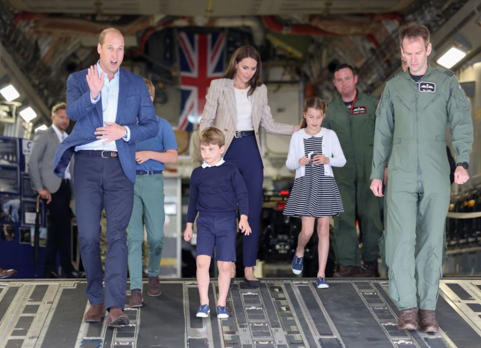 fairford, england july 14 prince william, prince of wales and catherine, princess of wales with prince george of wales, princess charlotte of wales and prince louis of wales c as they walk down the ramp of a c17 plane during their visit to the air tattoo at raf fairford on july 14, 2023 in fairford, england the prince and princess of wales have a strong relationship with the raf, with the prince having served with the search and rescue force for over three years, based at raf valley in anglesey the prince is honorary air commodore of raf coningsby and the princess is honorary air commodore of the air cadets photo by chris jacksongetty images