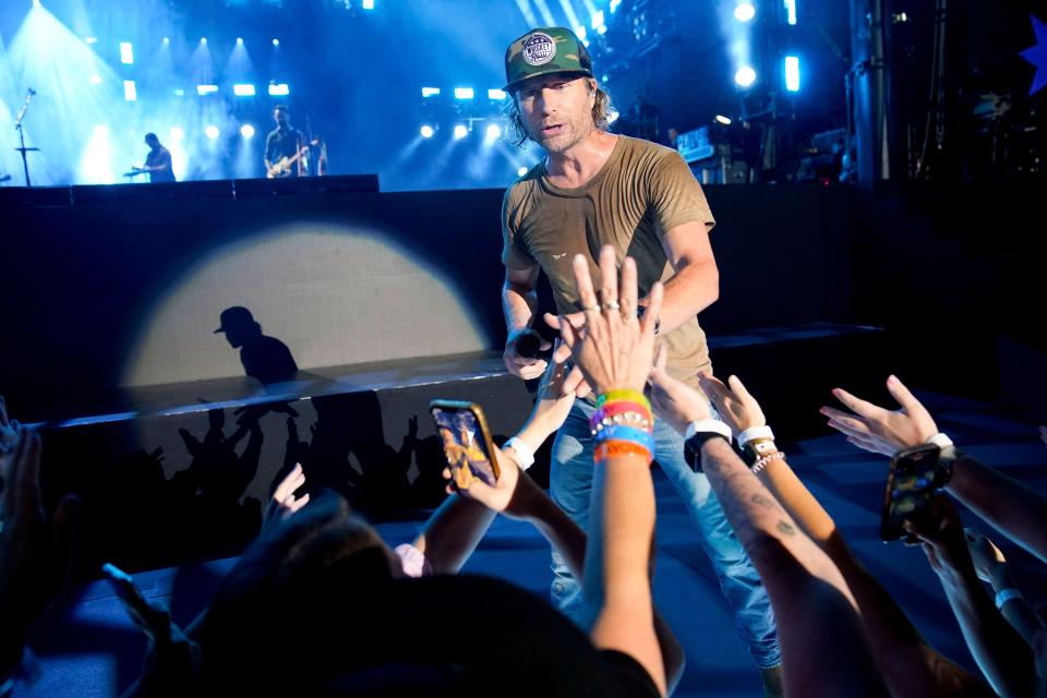 Dierks Bentley interacts with fans as he performs during CMA Fest at Nissan Stadium Sunday, June 12, 2022 in Nashville, Tennessee.