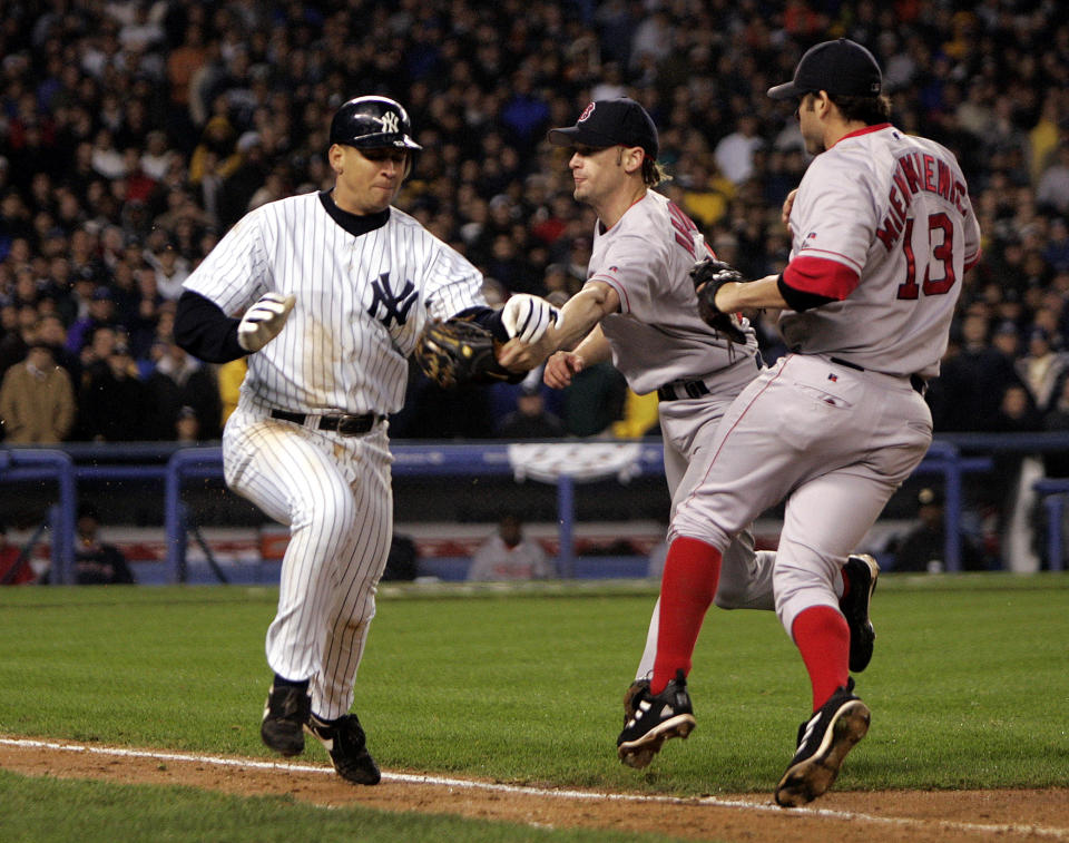 NEW YORK, NY - OCTOBER 19: New York Yankees' Alex Rodriguez heads into first base as Boston Red Sox pitcher Bronson Arroyo tries to tag him, during the eighth inning of the American League Championship Series at Yankee Stadium. Umpires ruled that Rodriguez was out because he batted the ball away from Arroyo. (Photo by Barry Chin/The Boston Globe via Getty Images)