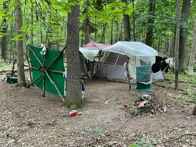 A well-established homeless camp sits off the Baw Beese Trail in Hillsdale near Baw Beese Lake.