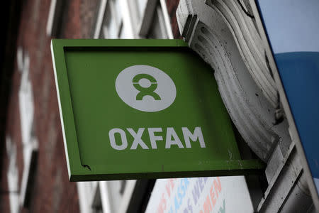 A sign is seen above a branch of Oxfam, in central London, Britain February 13, 2018. REUTERS/Simon Dawson