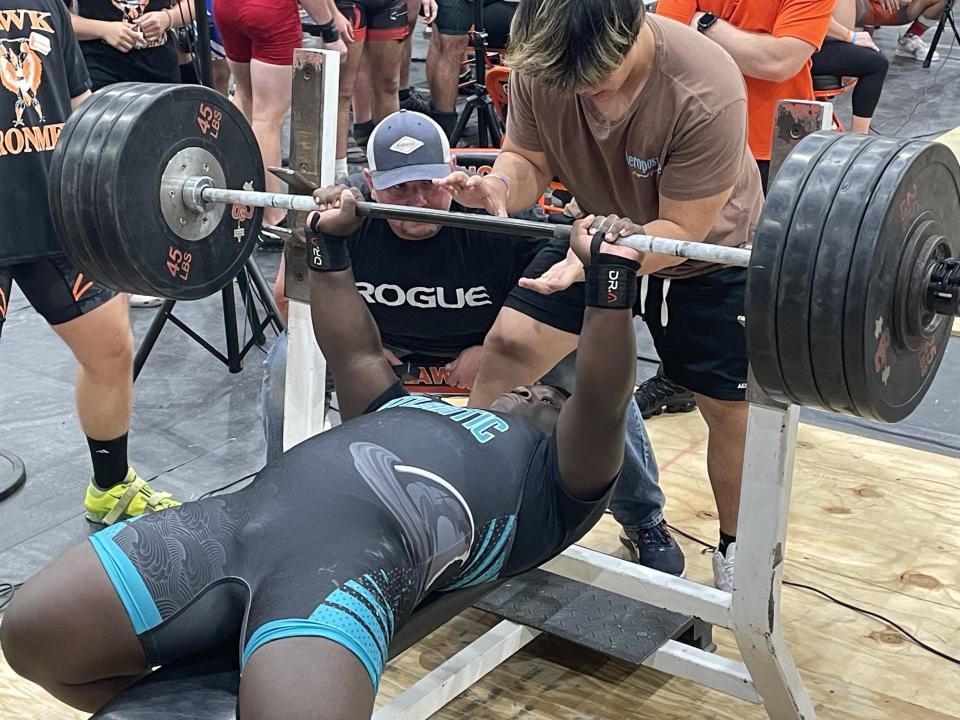 Atlantic's Windor Altinor finishes a 380-pound bench press, vaulting him into second place in the Five Star Conference traditional heavyweight competition.