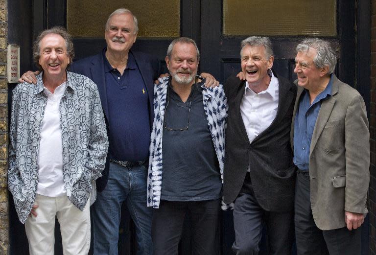 British comedy troupe Monty Python (L-R) Eric Idle, John Cleese, Terry Gilliam, Michael Palin and Terry Jones pose for a photograph at the back door to the London Palladium in central London on June 30, 2014