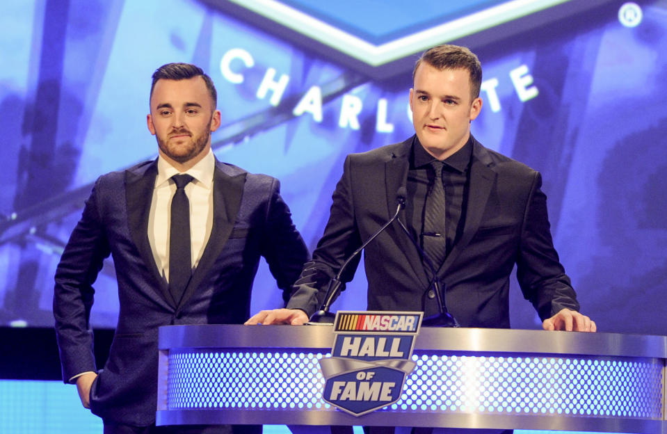 Austin Dillon, left, and Ty Dillon introduce their grandfather Richard Childress during the NASCAR Hall of Fame induction ceremony in Charlotte, N.C., Friday, Jan. 20, 2017. (AP Photo/Mike McCarn)
