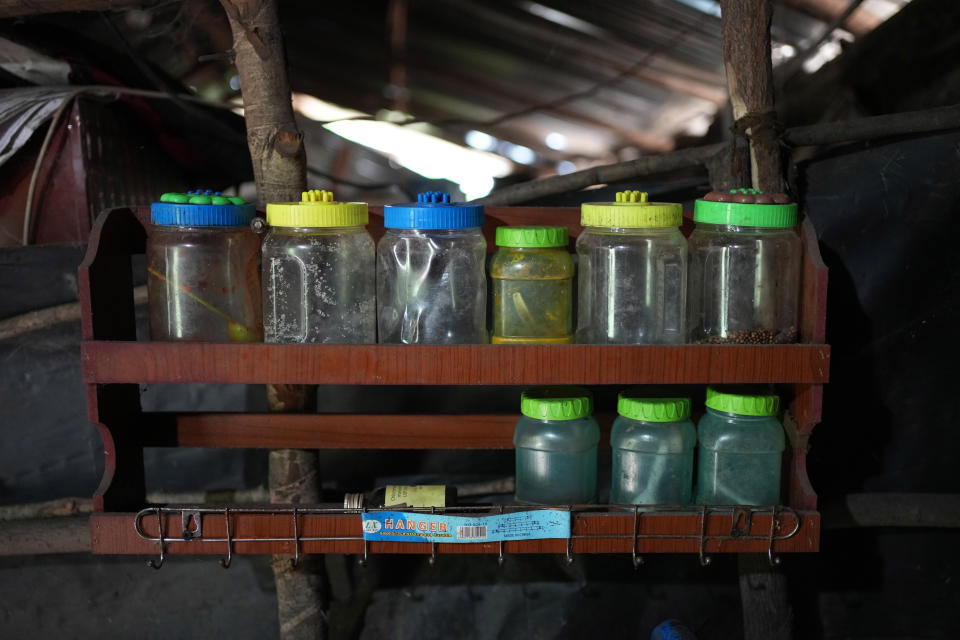 Empty spice containers are seen kept in a kitchen rack in Mahadamana village in Dimbulagala, about 200 kilometres northeast of Colombo, Sri Lanka, Sunday, Dec. 11, 2022. Due to Sri Lanka's current economic crisis families across the nation have been forced to cut back on food and other vital items because of shortages of money and high inflation. Many families say that they can barely manage one or two meals a day. (AP Photo/Eranga Jayawardena)