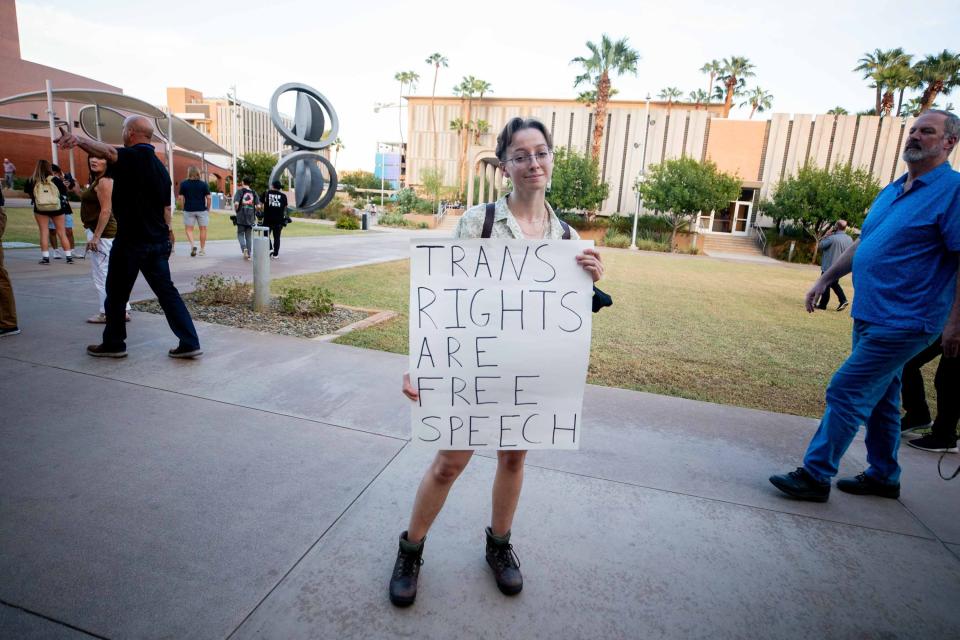 Hypatia Meraviglia holds up a sign prior to a Turning Point USA event at the ASU Katzin Concert Hall in Tempe on Sept. 27, 2023.