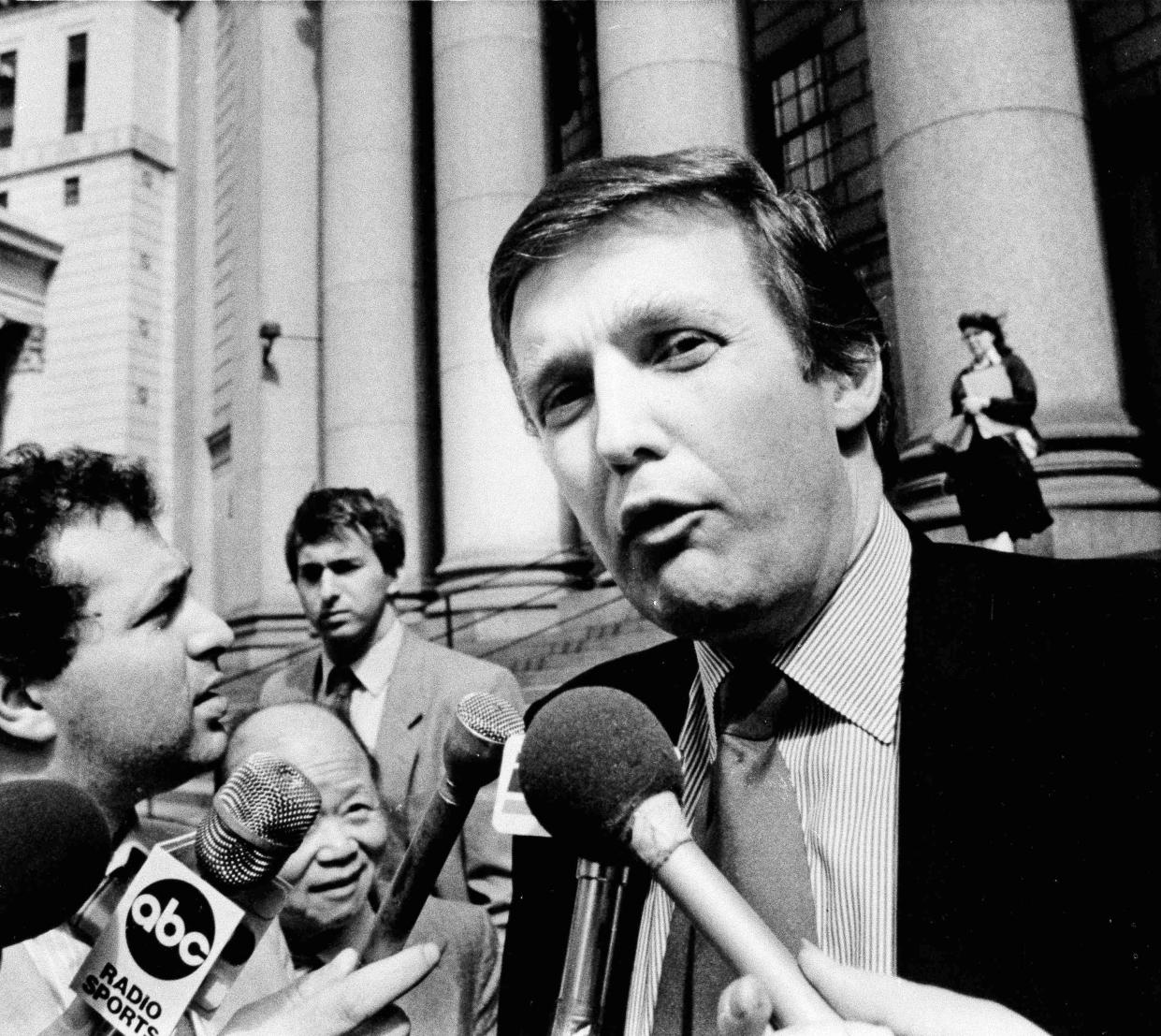 Donald Trump, real estate mogul and owner of the USFL's New Jersey Generals, speaks to the press as he walks out of federal court in New York on May 14, 1986. A federal court jury heard vivid charges of intrigue and conspiracy in the world of professional football as the USFL's $1.32 billion anti-trust suit against the NFL opened Wednesday with sharply contrasting views of the battle between the two leagues.