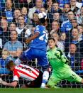 Chelsea's Samuel Eto'o (2nd L) scores beating Sunderland's goalkeeper Vito Mannone (R) during an English Premier League football match at Stamford Bridge in London on April 19, 2014