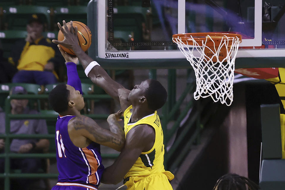 Northwestern State forward Justin Wilson (11) has his shot blocked by Baylor forward Jonathan Tchamwa Tchatchoua (23) during the first half of an NCAA college basketball game Saturday, Dec. 2, 2023, in Waco, Texas. (AP Photo/Jerry Larson)