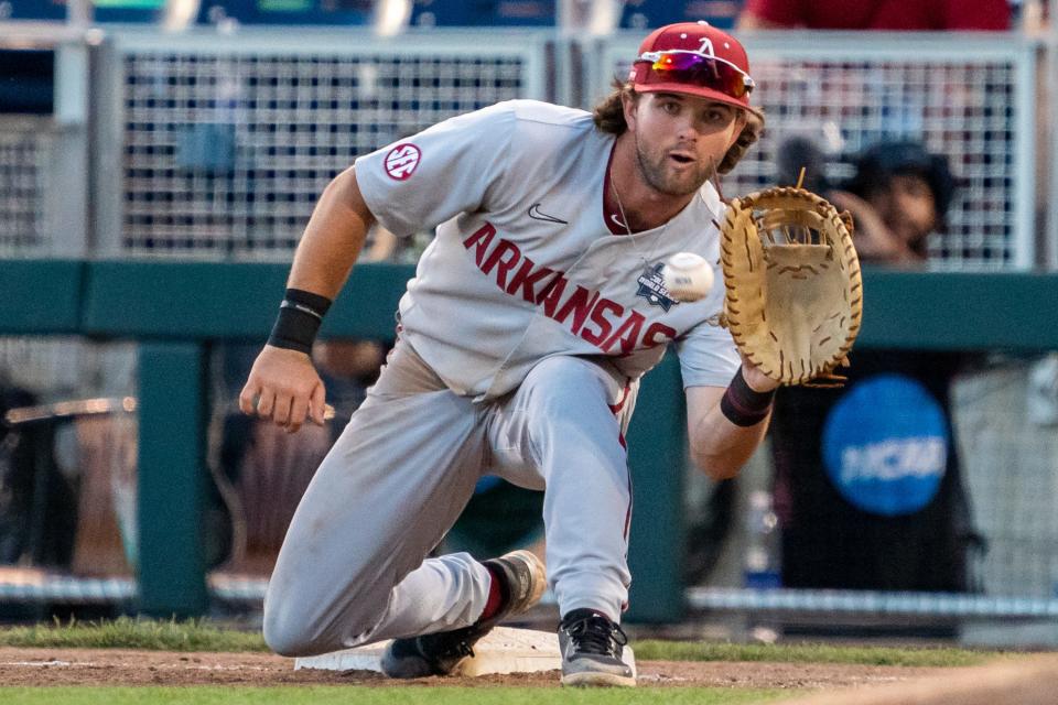 Jun 21, 2022; Omaha, NE, USA; Arkansas Razorbacks first baseman Peyton Stovall (10) gets an out against the Auburn Tigers to end the seventh inning at Charles Schwab Field. Mandatory Credit: Dylan Widger-USA TODAY Sports