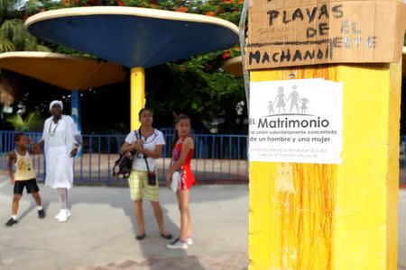 A placard opposing gay marriage is seen on a pole in Havana, Cuba, July 19, 2018. The placard reads "Marriage is the voluntarily arranged union of a man and a woman". REUTERS/Stringer