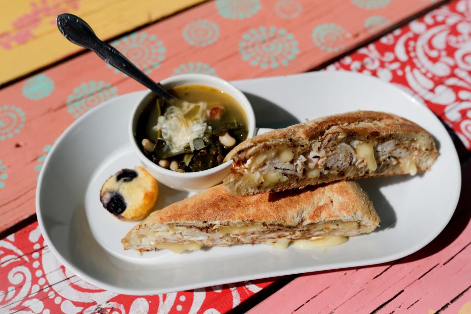 The menu at Jeri's Midtown Cafe includes a sandwich called "The 'TAB,'" which includes sliced roasted turkey, apple butter, and Il de France brie on a Tribeca Demi baguette, served here with a cup of the restaurant's collard soup. 