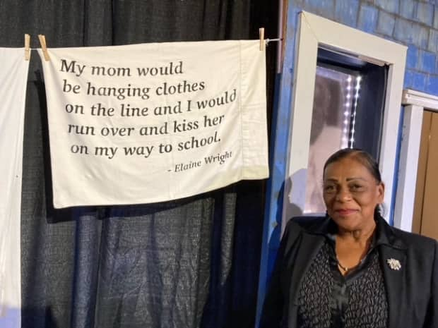 Angel Gannon stands in front of a display at the new exhibit she built to celebrate Africville. (Submitted by Juanita Peters - image credit)