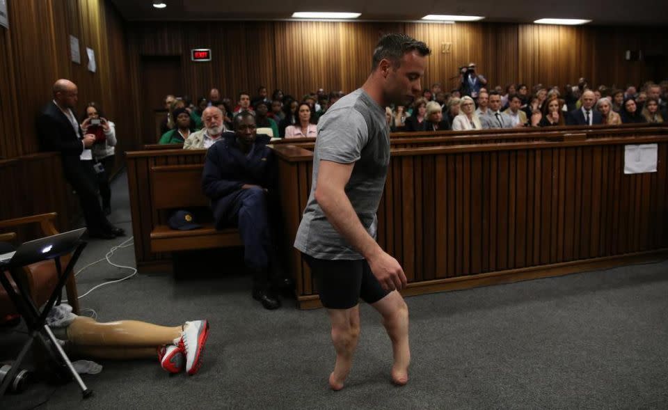 Oscar Pistorius walks without his prosthetic legs. Picture: AP