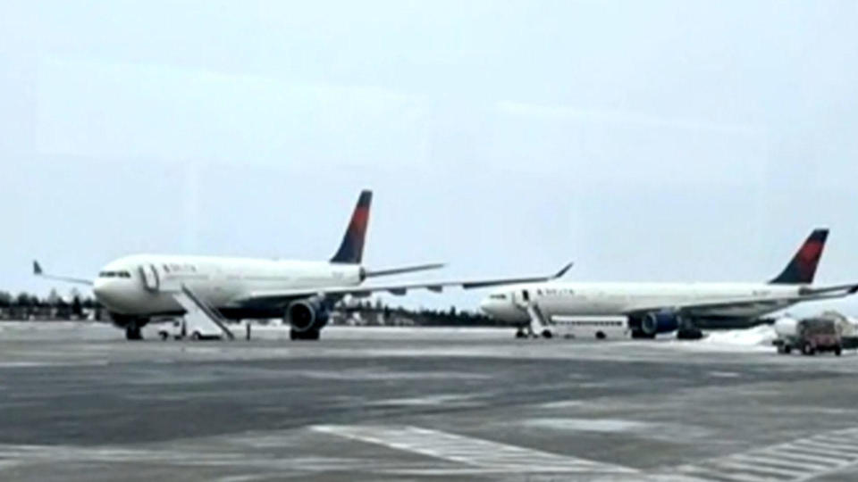 Delta planes on the runway at Goose Bay Airport.  / Credit: CBS Evening News